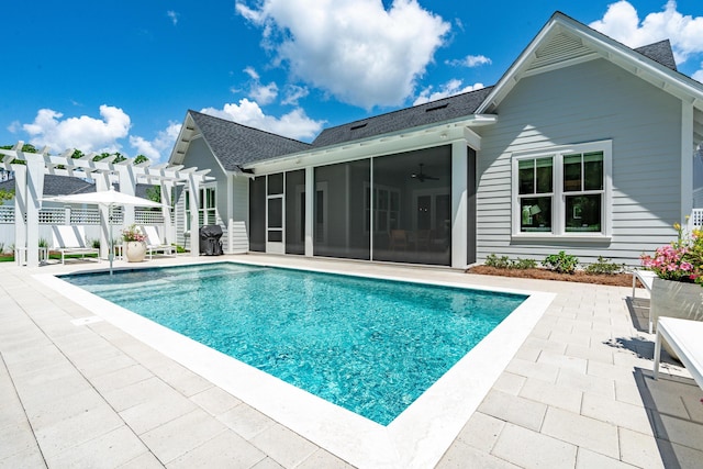 view of pool with a sunroom, a patio area, a fenced in pool, and a pergola