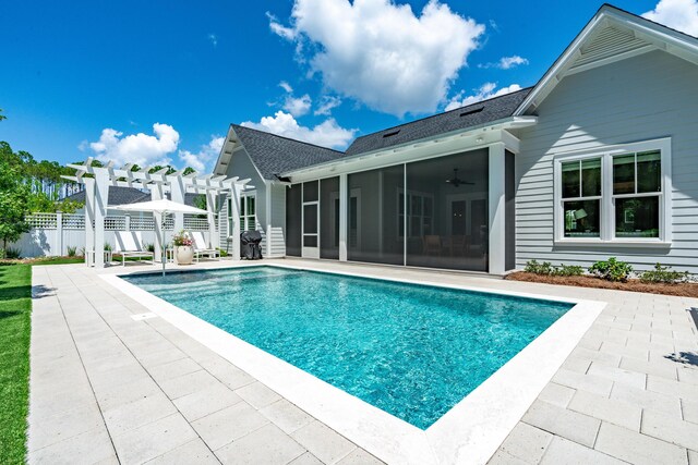 view of pool featuring a pergola, a patio, and ceiling fan