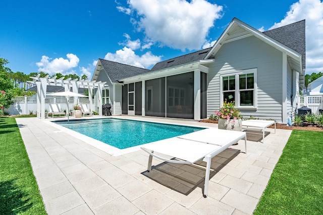 view of swimming pool with a fenced in pool, a patio, a sunroom, fence, and a pergola