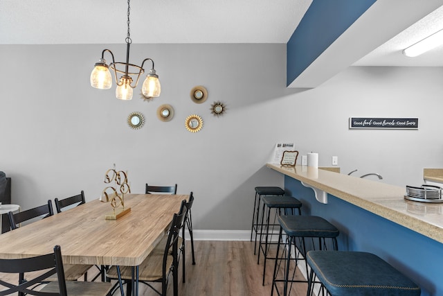 dining space with light hardwood / wood-style flooring