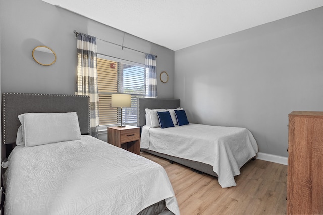 bedroom with light wood-type flooring