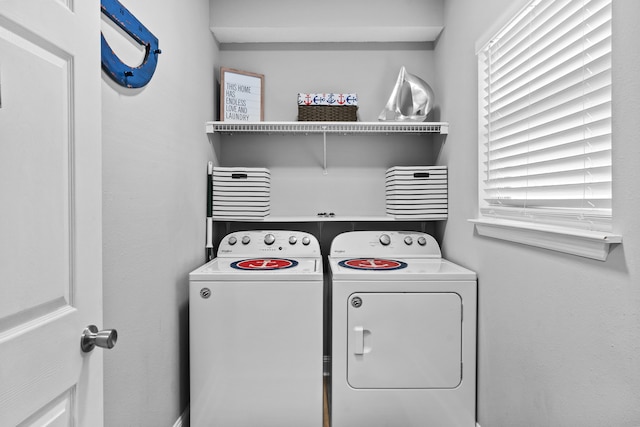 washroom featuring washing machine and clothes dryer