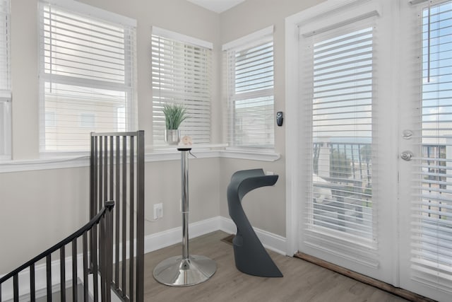 interior space featuring light wood-style flooring and baseboards