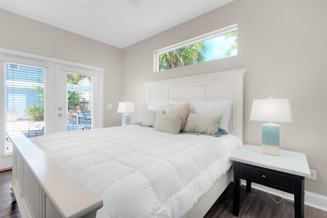 bedroom with baseboards, french doors, dark wood-type flooring, and access to exterior