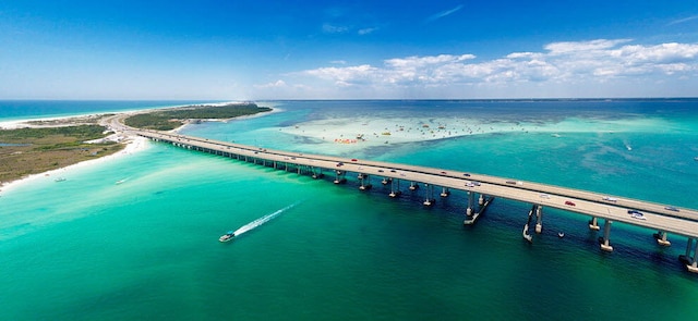 aerial view featuring a water view and a beach view