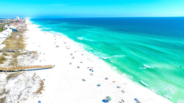 bird's eye view with a water view and a view of the beach