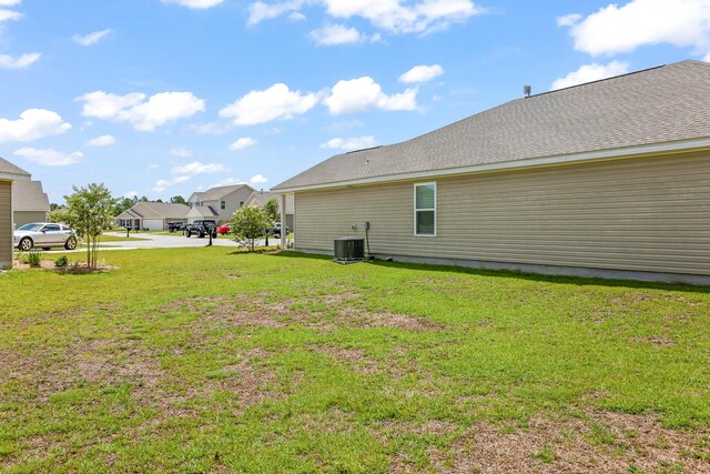 view of yard with central AC