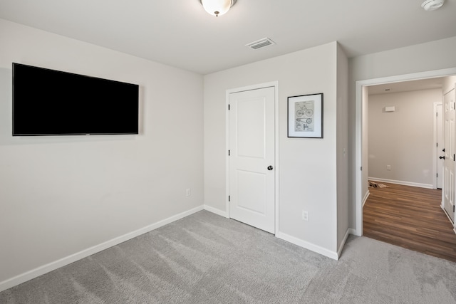 unfurnished bedroom with carpet floors