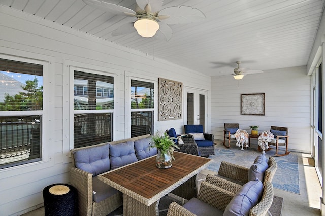 sunroom with ceiling fan and french doors