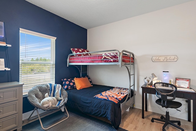 bedroom with light hardwood / wood-style floors