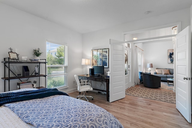 bedroom featuring light wood-type flooring