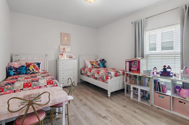 bedroom featuring light wood-type flooring