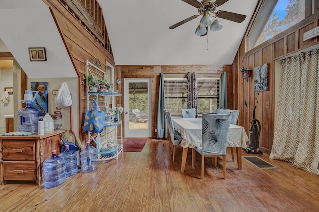 sunroom featuring ceiling fan and vaulted ceiling