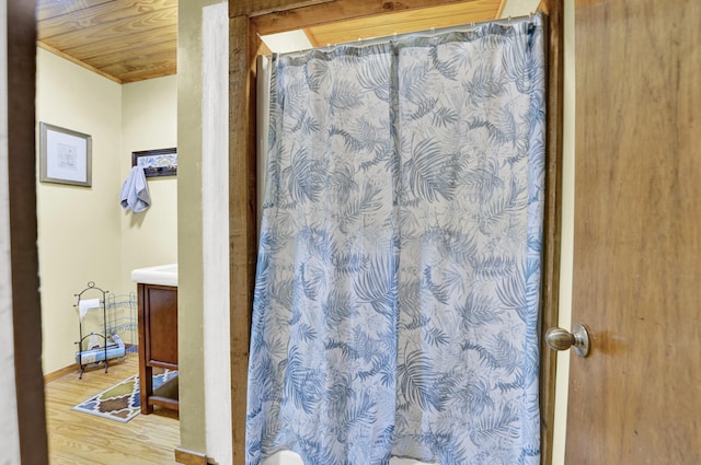 bathroom with wood ceiling, hardwood / wood-style floors, vanity, and a shower with curtain