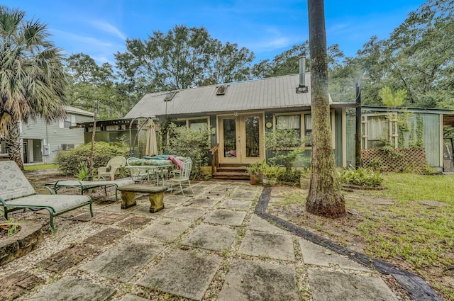 rear view of property with a patio area