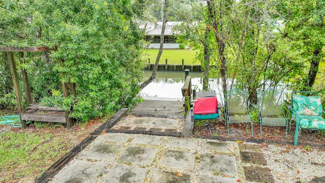 surrounding community featuring a patio area and a dock