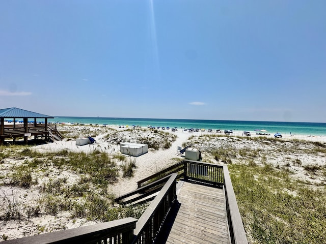 view of water feature featuring a beach view and a gazebo