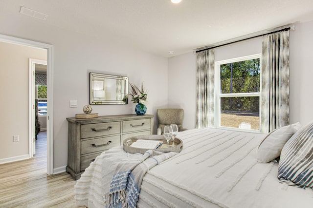 bedroom with light hardwood / wood-style flooring