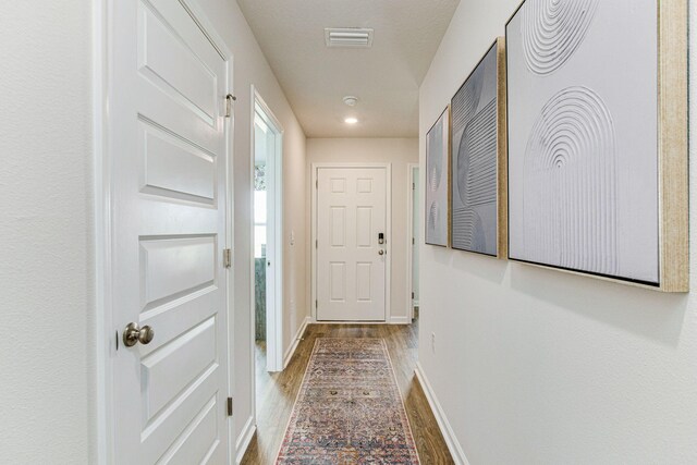 doorway featuring hardwood / wood-style flooring