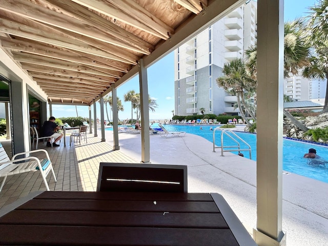 view of swimming pool featuring a patio