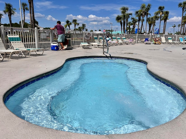 view of pool featuring a patio