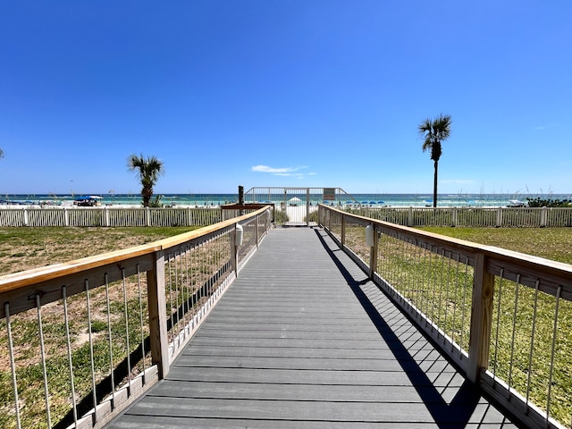 surrounding community featuring a view of the beach and a water view