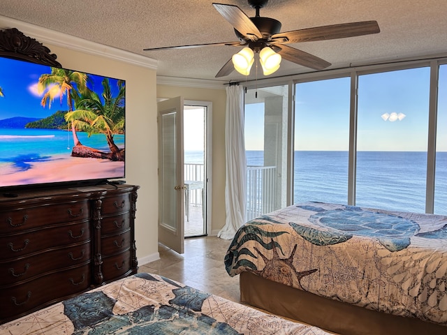 bedroom featuring ceiling fan, a water view, a textured ceiling, and ornamental molding