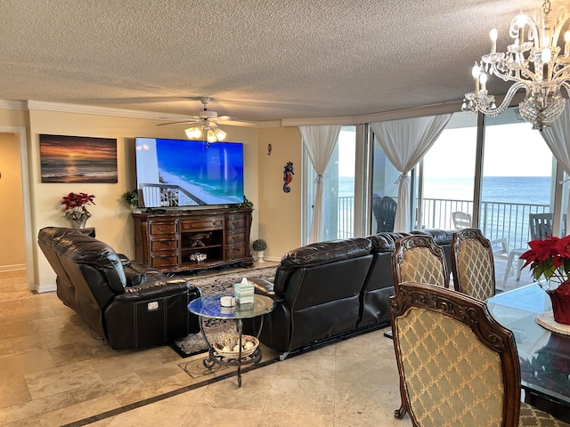 living room with a textured ceiling, crown molding, and ceiling fan with notable chandelier