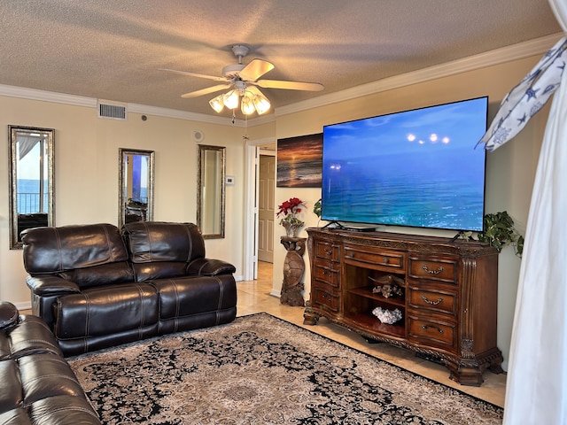 tiled living room featuring ceiling fan, crown molding, and a textured ceiling