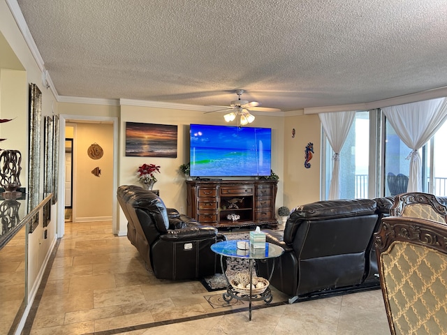 living room with ceiling fan, crown molding, and a textured ceiling