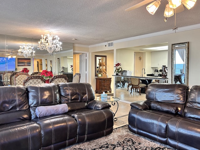 living room with sink, ceiling fan with notable chandelier, crown molding, and a textured ceiling