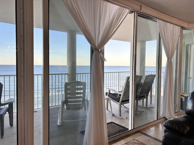 balcony featuring a water view