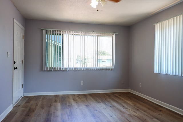 empty room featuring ceiling fan and wood-type flooring