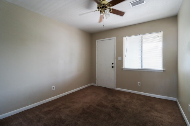 foyer entrance featuring ceiling fan and carpet flooring