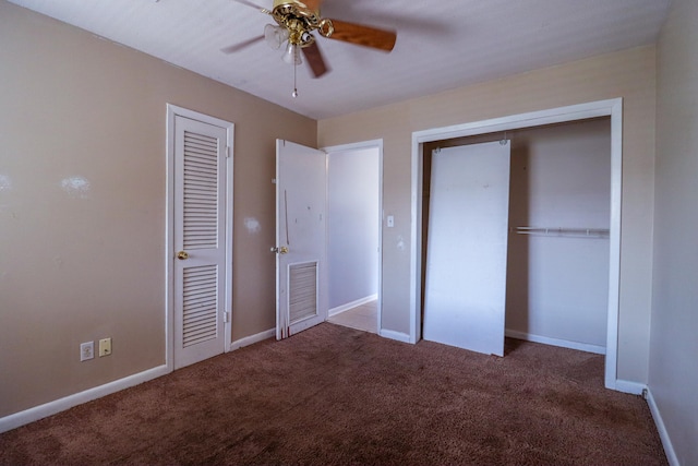 unfurnished bedroom with ceiling fan and carpet