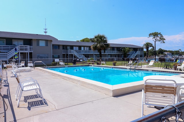 view of pool featuring a patio area