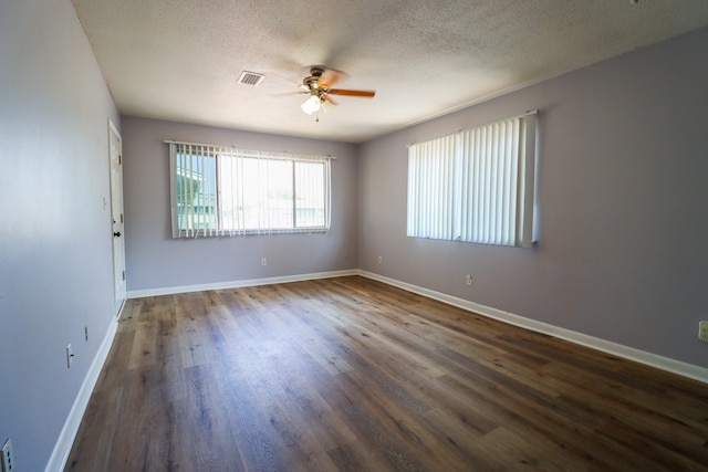 unfurnished room featuring a textured ceiling, ceiling fan, and hardwood / wood-style floors