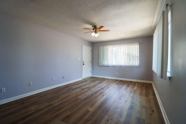 empty room featuring a textured ceiling, ceiling fan, and hardwood / wood-style floors