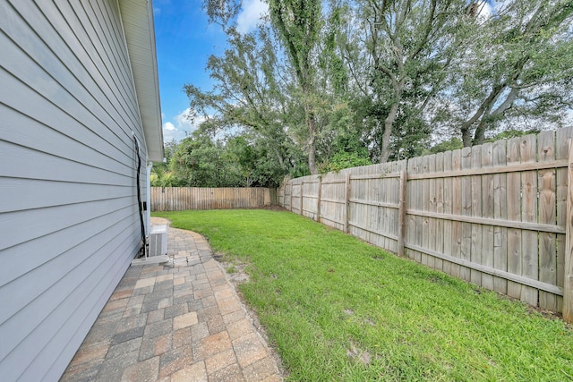 view of yard featuring cooling unit and a fenced backyard