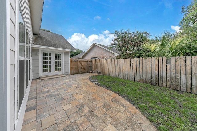 view of patio / terrace featuring a fenced backyard and french doors