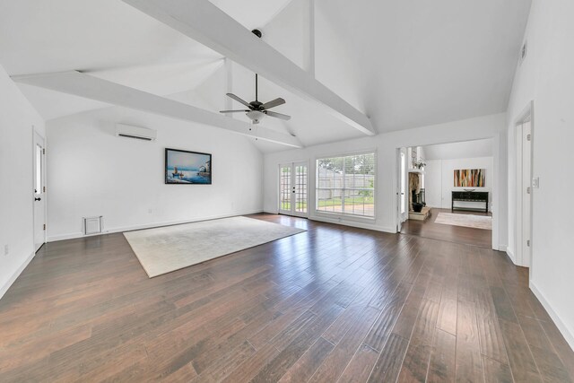 unfurnished living room featuring ceiling fan, dark wood-type flooring, high vaulted ceiling, beamed ceiling, and a wall mounted air conditioner