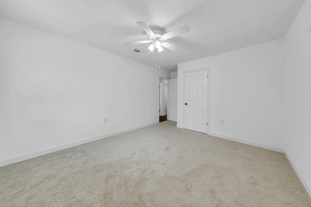 unfurnished bedroom featuring ceiling fan and light carpet