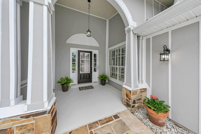 property entrance with stucco siding