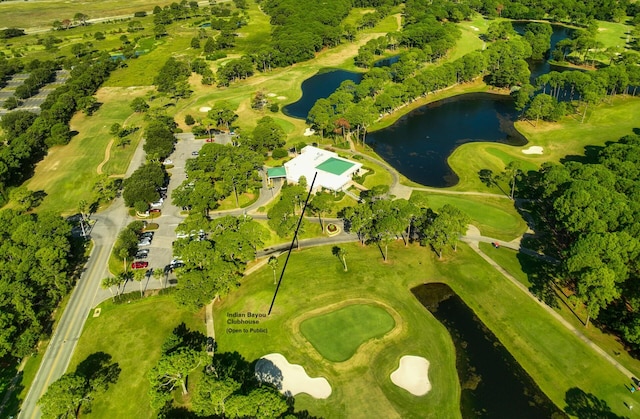 bird's eye view with view of golf course and a water view