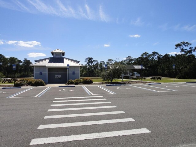 view of vehicle parking featuring a garage