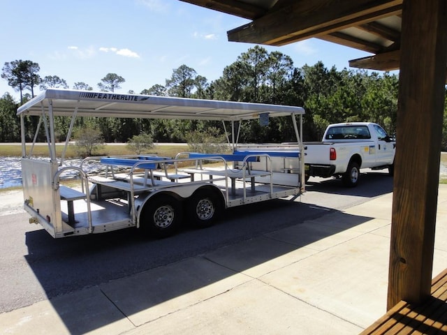 view of parking / parking lot featuring a carport