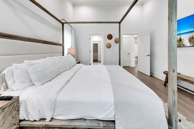 bedroom with hardwood / wood-style flooring