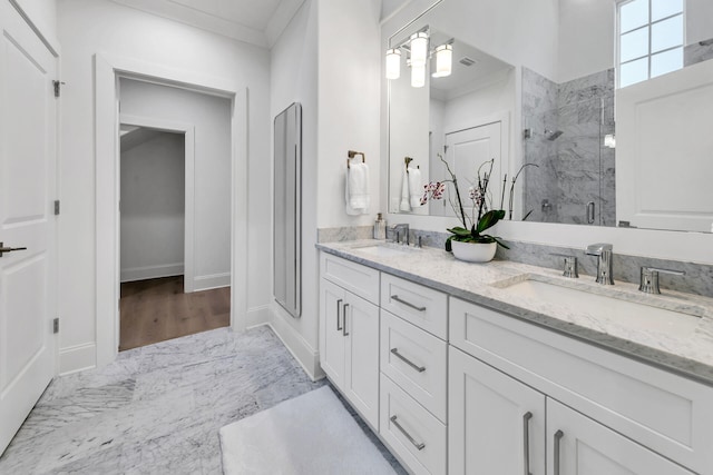 bathroom featuring ornamental molding, a shower with door, wood-type flooring, and vanity