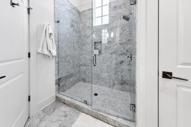 bathroom with tile patterned flooring and an enclosed shower