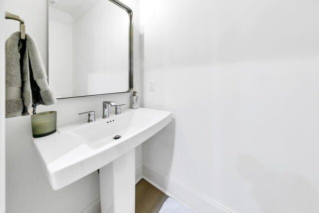 bathroom featuring hardwood / wood-style flooring